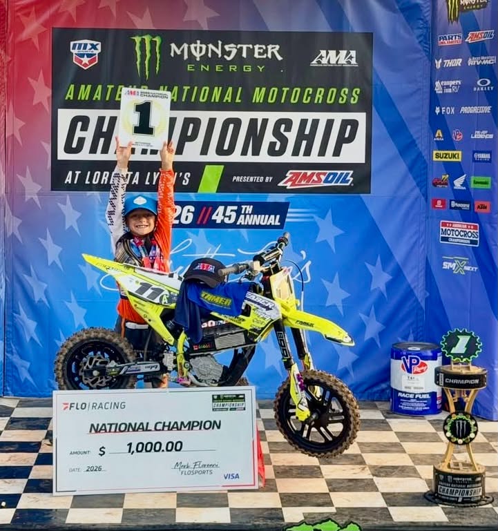 Brantley Faber celebrating his 2026 championship with his bike and trophies